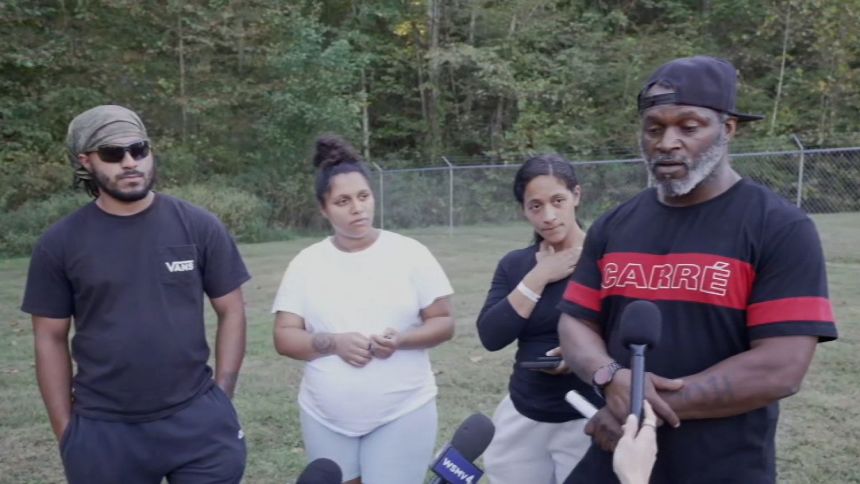The Mays family speaks to the media Sunday in Bucksnort, Tennessee, about their loved one, LaTeisha Mays, an employee at Accurate Energetic Systems.