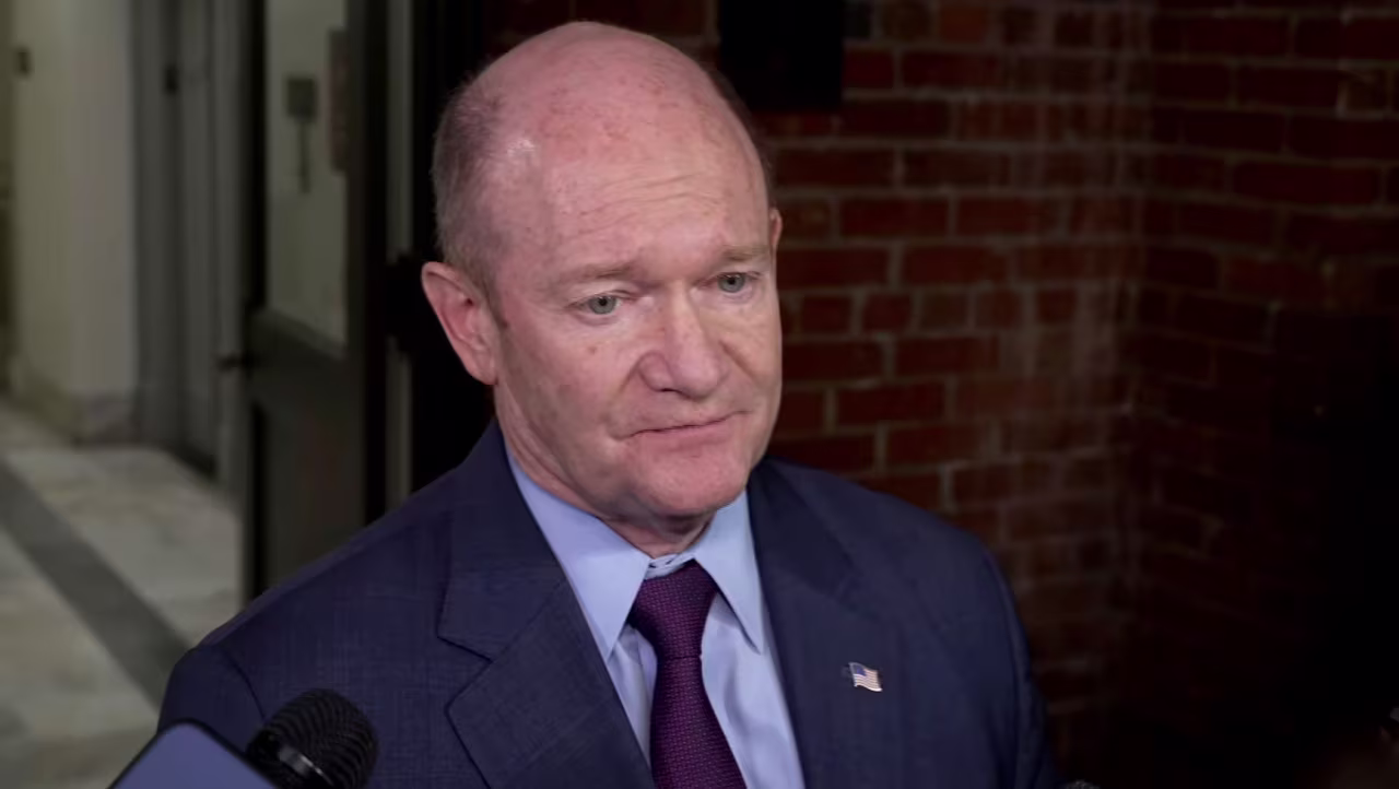 Sen. Chris Coons speaks with members of the media on Thursday.