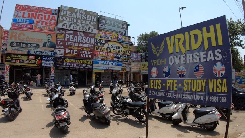 Education consultant centers for students hoping to apply to universities overseas are advertised in Karnal, Haryana, India.