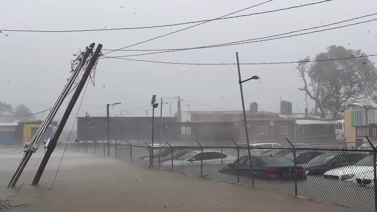 Flooding and strong winds hit western Jamaica on Tuesday.