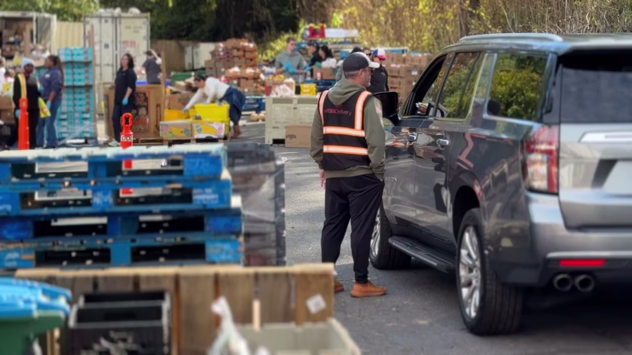 Volunteers work at a food bank in North Bethesda, Maryland on Sunday.