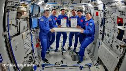 Crew members of Shenzhou-20 and Shenzhou-21 signing documents for work handover on November 4, 2025.
