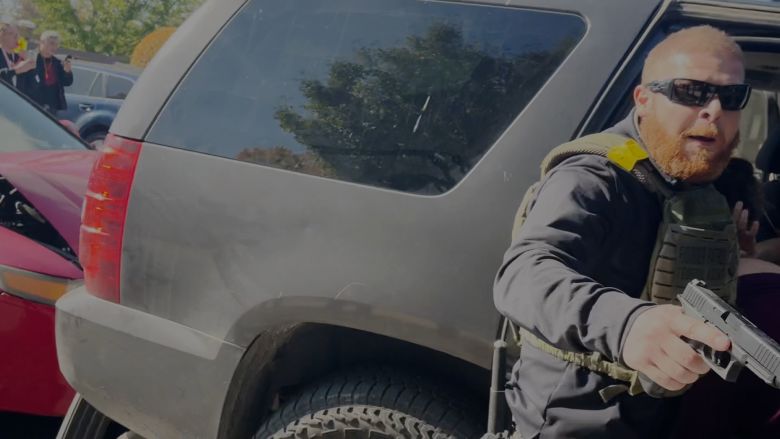 The officer then turned to draw his gun and point it towards Brooks, as seen in this still.