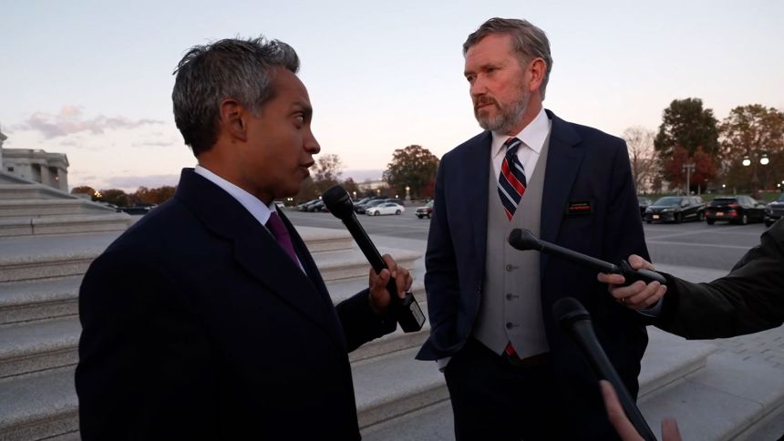 Rep. Thomas Massie, right, talks with CNN's Manu Raju on Wednesday.