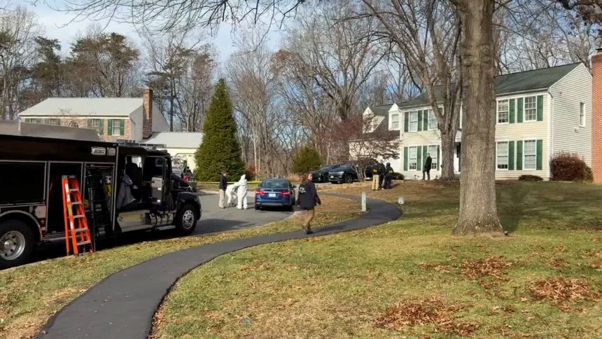 Law enforcement works near the Woodbridge, Virginia, home of a man suspected of planting pipe bombs near the Republican and Democratic National Committee headquarters the night before the 2021 US Capitol riot, on Thursday, December 4, 2025.