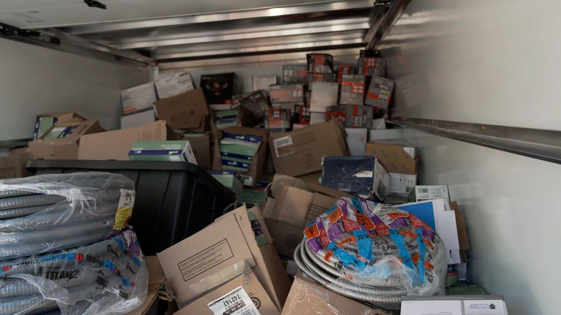 Seized goods fill a Home Depot truck after a law enforcement raid.