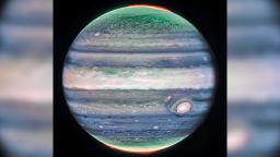 This image of Jupiter from NASA’s James Webb Space Telescope’s NIRCam (Near-Infrared Camera) shows stunning details of the majestic planet in infrared light. In this image, brightness indicates high altitude. The numerous bright white ‘spots’ and ‘streaks’ are likely very high-altitude cloud tops of condensed convective storms. Auroras, appearing in red in this image, extend to higher altitudes above both the northern and southern poles of the planet. By contrast, dark ribbons north of the equatorial region have little cloud cover.</p><p>In Webb’s images of Jupiter from July 2022, researchers recently discovered a narrow jet stream traveling 320 miles per hour (515 kilometers per hour) sitting over Jupiter’s equator above the main cloud decks.