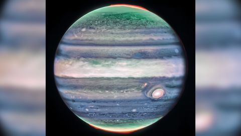 This image of Jupiter from NASA’s James Webb Space Telescope’s NIRCam (Near-Infrared Camera) shows stunning details of the majestic planet in infrared light. In this image, brightness indicates high altitude. The numerous bright white ‘spots’ and ‘streaks’ are likely very high-altitude cloud tops of condensed convective storms. Auroras, appearing in red in this image, extend to higher altitudes above both the northern and southern poles of the planet. By contrast, dark ribbons north of the equatorial region have little cloud cover.<br /><br /><br /><br /><br />In Webb’s images of Jupiter from July 2022, researchers recently discovered a narrow jet stream traveling 320 miles per hour (515 kilometers per hour) sitting over Jupiter’s equator above the main cloud decks.