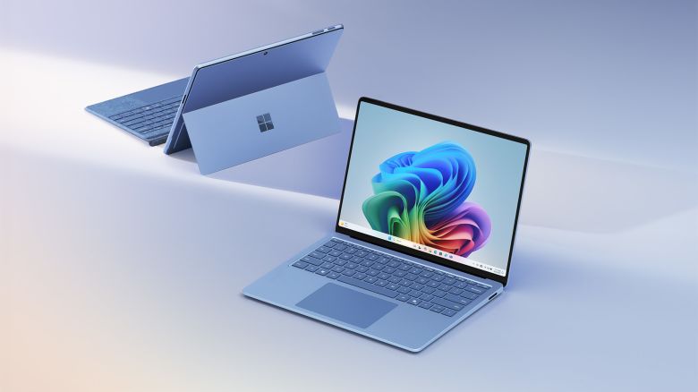 (L, R) the Microsoft Surface Pro (2024) as seen from behind is behind the Surface Laptop (2024)