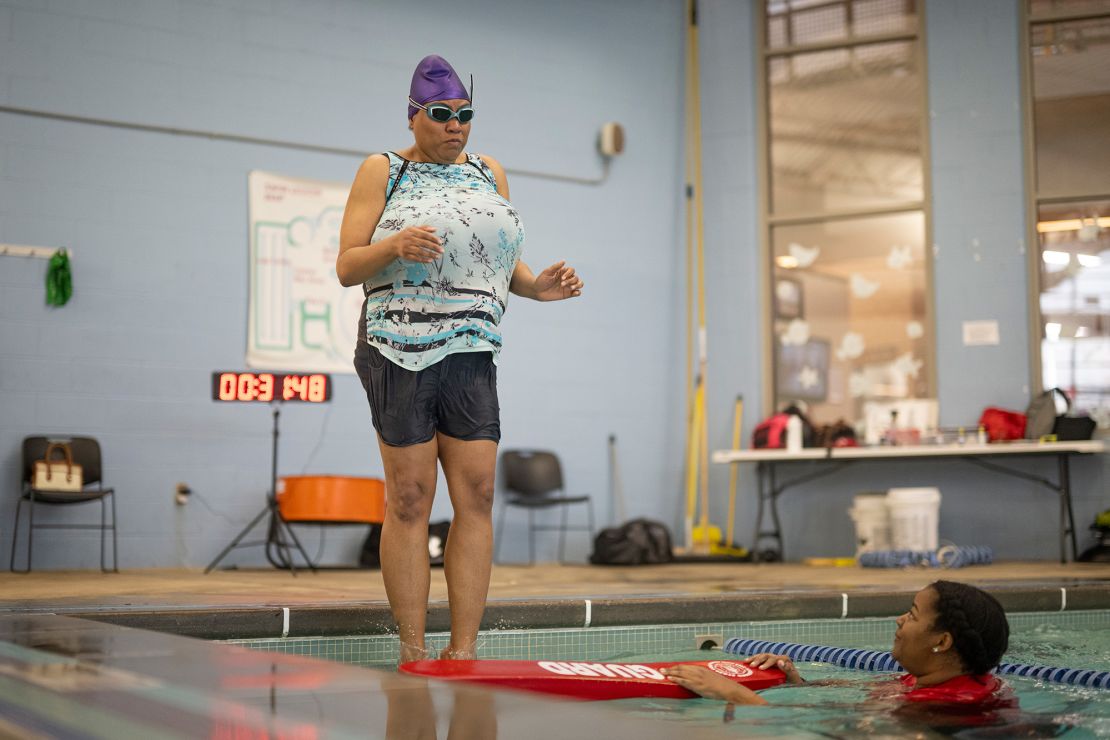 Bradlin Jacob-Simms (left) gets into the pool with swim instructor Mahoganny Richardson on hand at the YMCA’s O’Fallon Park Rec Complex on March 18.