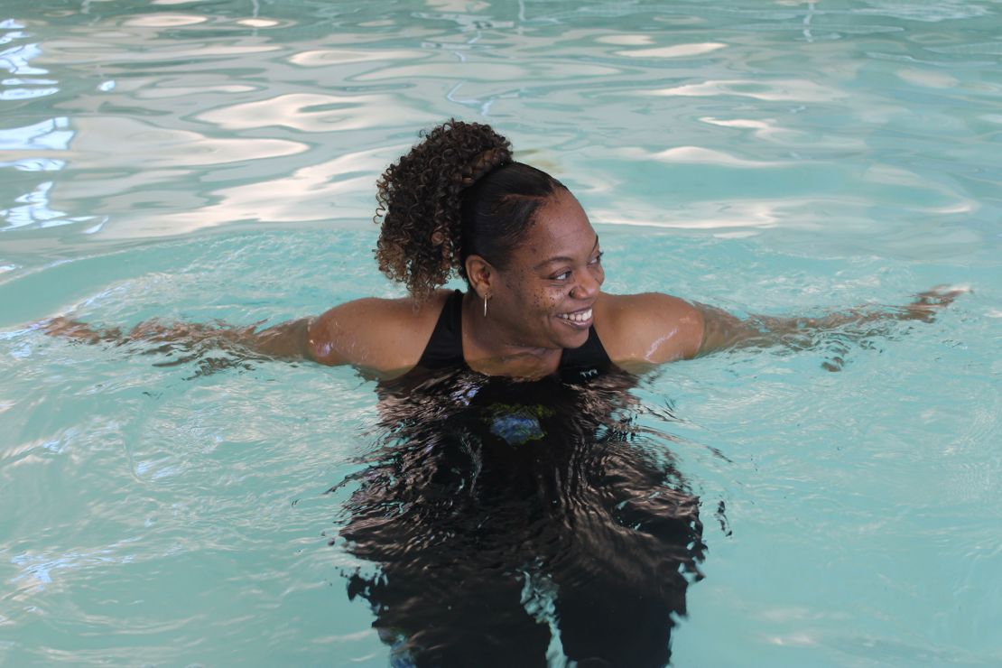 Former lifeguard Terea Goodwin, known as Coach T, swims at the YMCA’s O’Fallon Park Rec Complex on March 18.