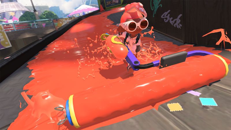 a player cruising through a stage in Splatoon 3 with the Splat Roller.