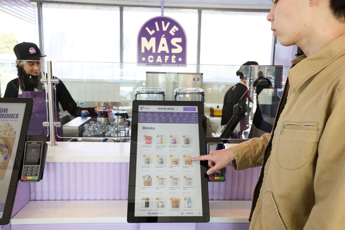 Customers at the Live Más Café order via kiosks.