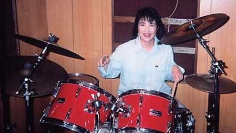 Takaichi is seen playing the drums in an undated photo. She is a fan of heavy metal music.