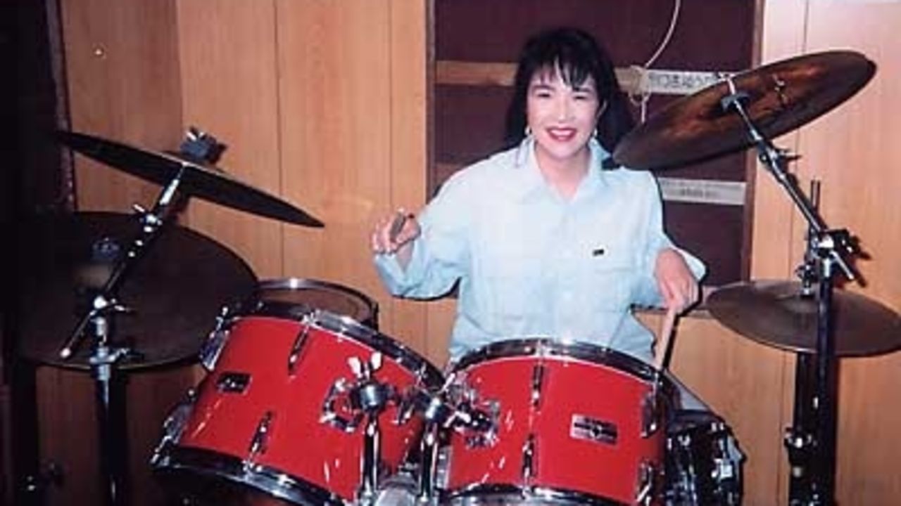Takaichi is seen playing the drums in an undated photo. She is a fan of heavy metal music.