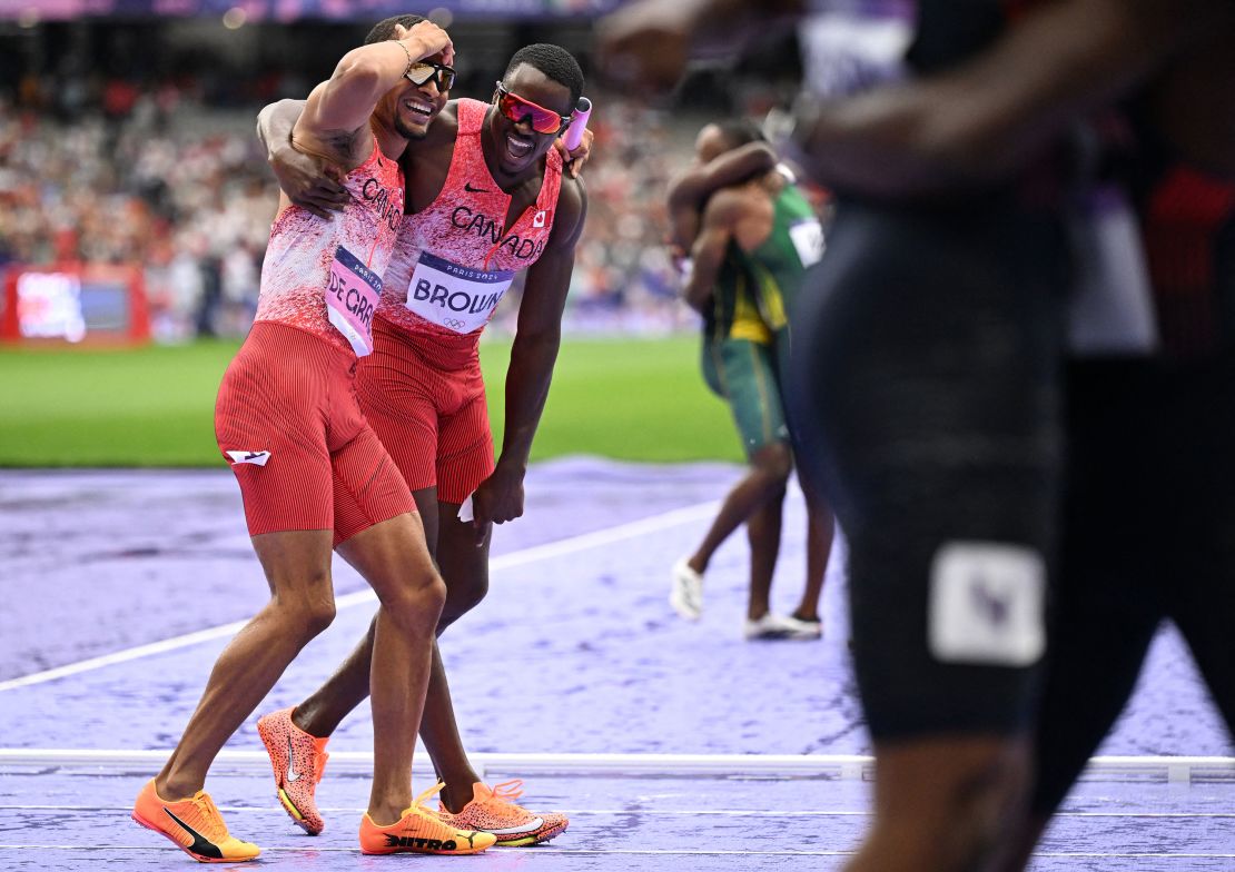 Canada's Andre De Grasse (L) celebrates with Canada's Aaron Brown after winning the men's 4x100m relay final of the athletics event.