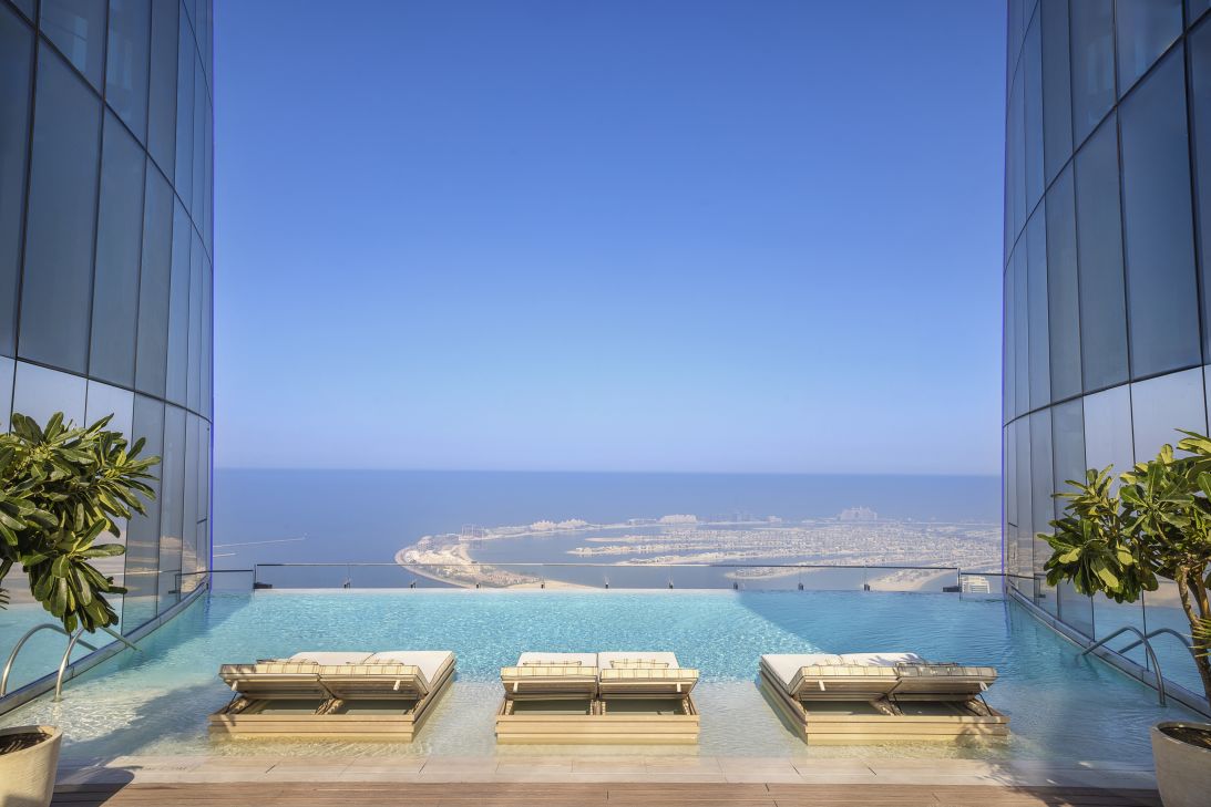 The infinity pool on the 76th floor disappeared into the sky.
