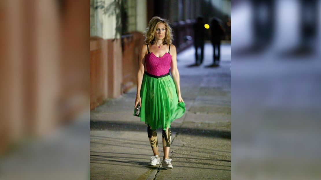 Sarah Jessica Parker as Carrie Bradshaw walks home in borrowed sneakers in an August 2003 episode of "Sex and the City" that aired on HBO, which is owned by CNN’s parent company. Her Manolo Blahnik shoes were stolen after her friend asked guests to leave their shoes at the front door.