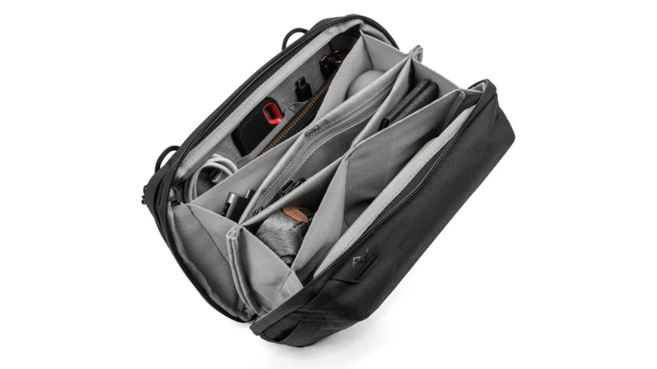 The opened Peak Design tech pouch has many pockets
