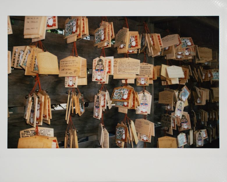 EMA, wooden plaques containing written prayers and wishes hang from the walls of the Gotokuji Temple in Tokyo.
