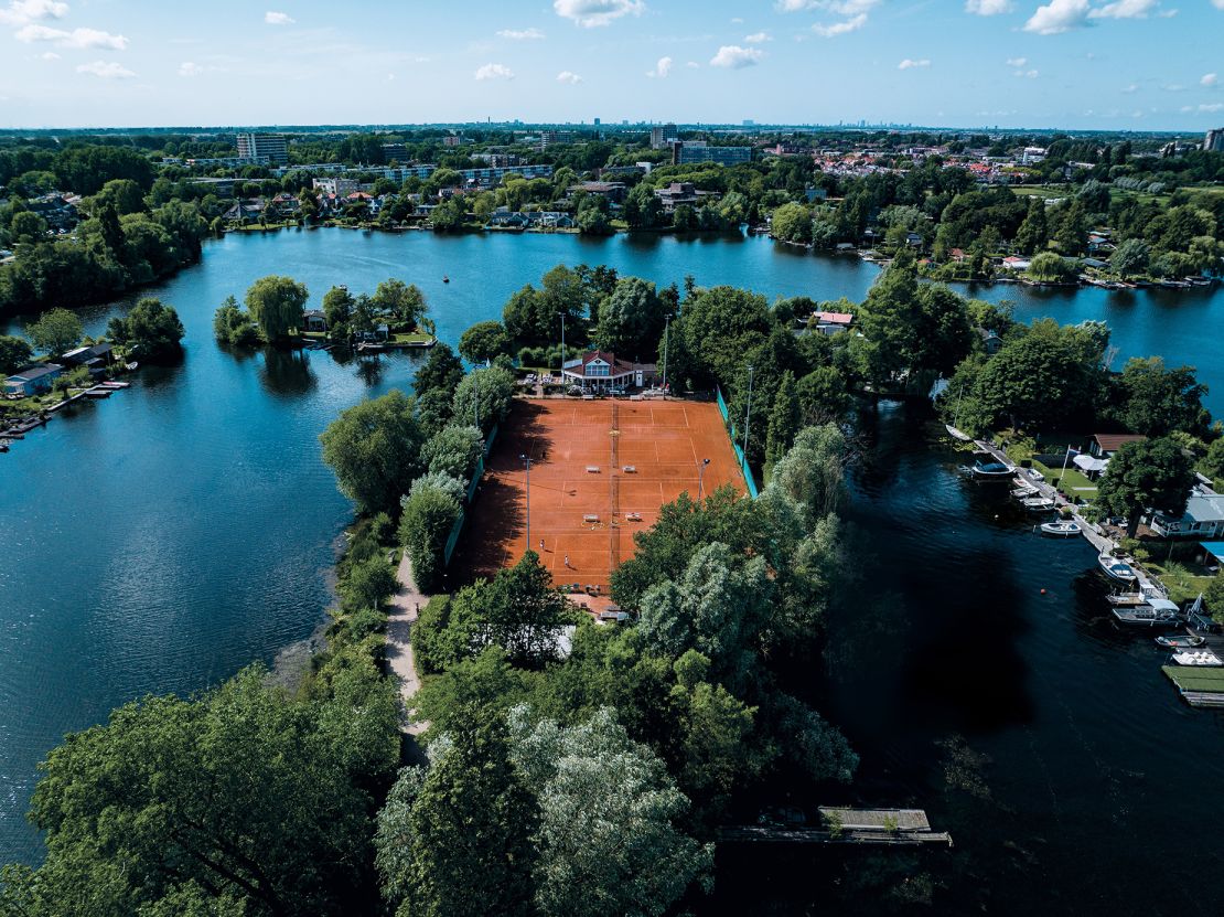 Tennispark, Lommerrijk in Rotterdam, The Netherlands has four clay courts on a promontory overlooking the Berge Achterplas wetlands.