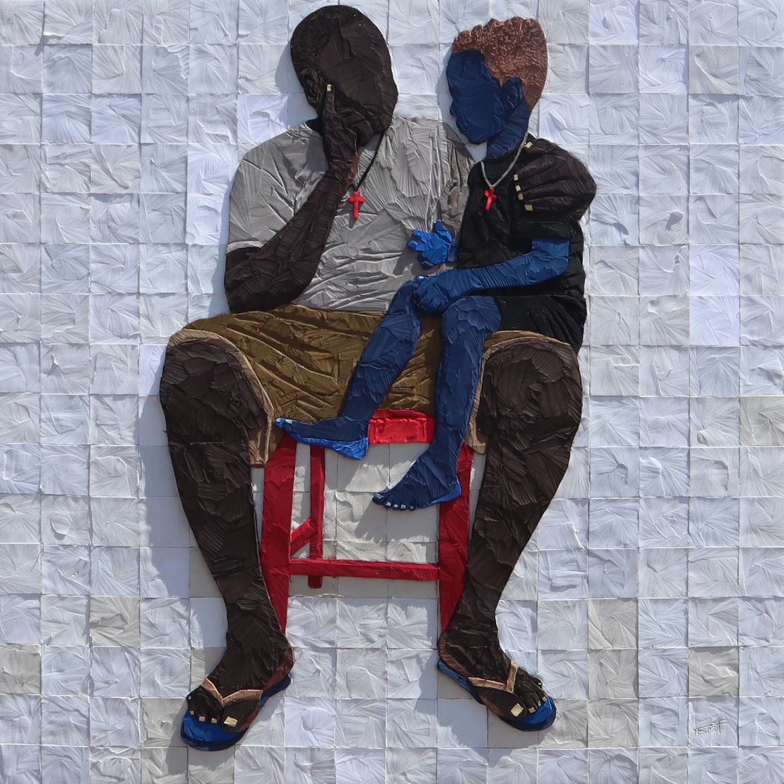 Tesprit worked with the soles of flip flops salvaged from landfill to create a 3D sculpture depicting fatherhood to complement Mr Eazi's song 'Mandela."