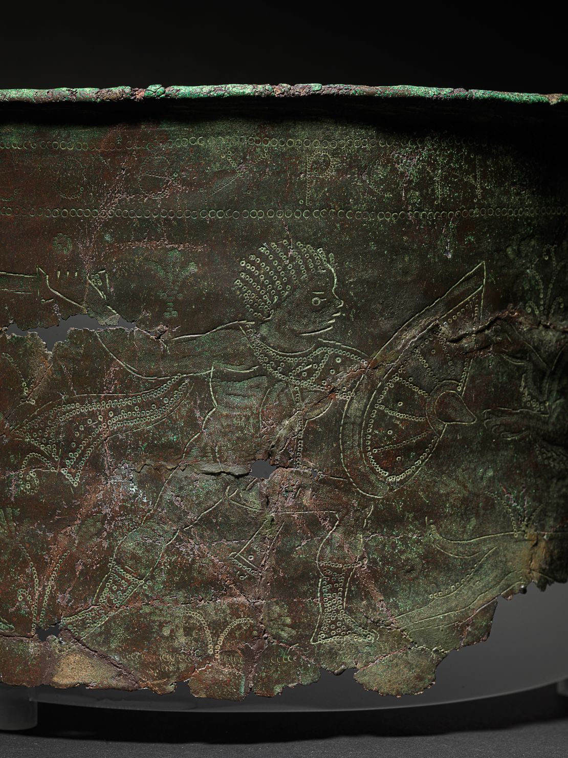 Fragments of the Bromeswell bucket found during previous excavations depict a North African hunting scene. They are on display in the High Hall exhibition at Sutton Hoo in Suffolk, England.