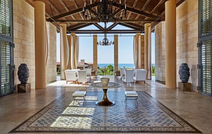 <strong>Lobby with a view: </strong>At The Romanos, guests can relax in this open-air lobby with a sea view.