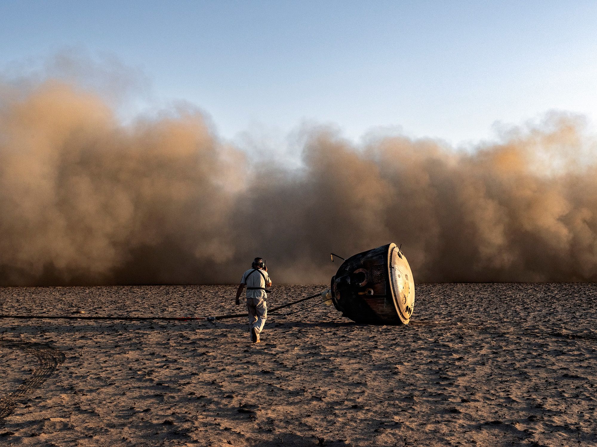 A Soyuz landing module lies on the Kazakh Steppe shortly after its return to Earth from the International Space Station.