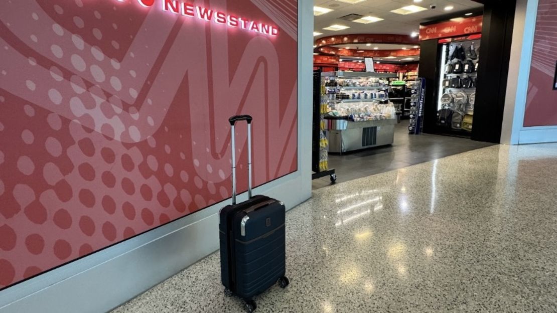 The Travelpro? x Travel + Leisure? Carry-On Spinner in front of CNN