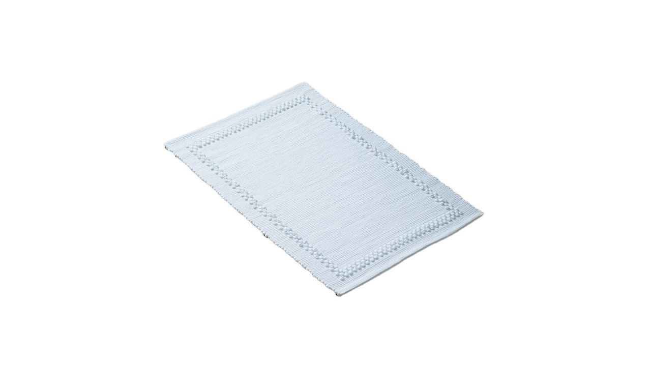 White rug placed against a white background.