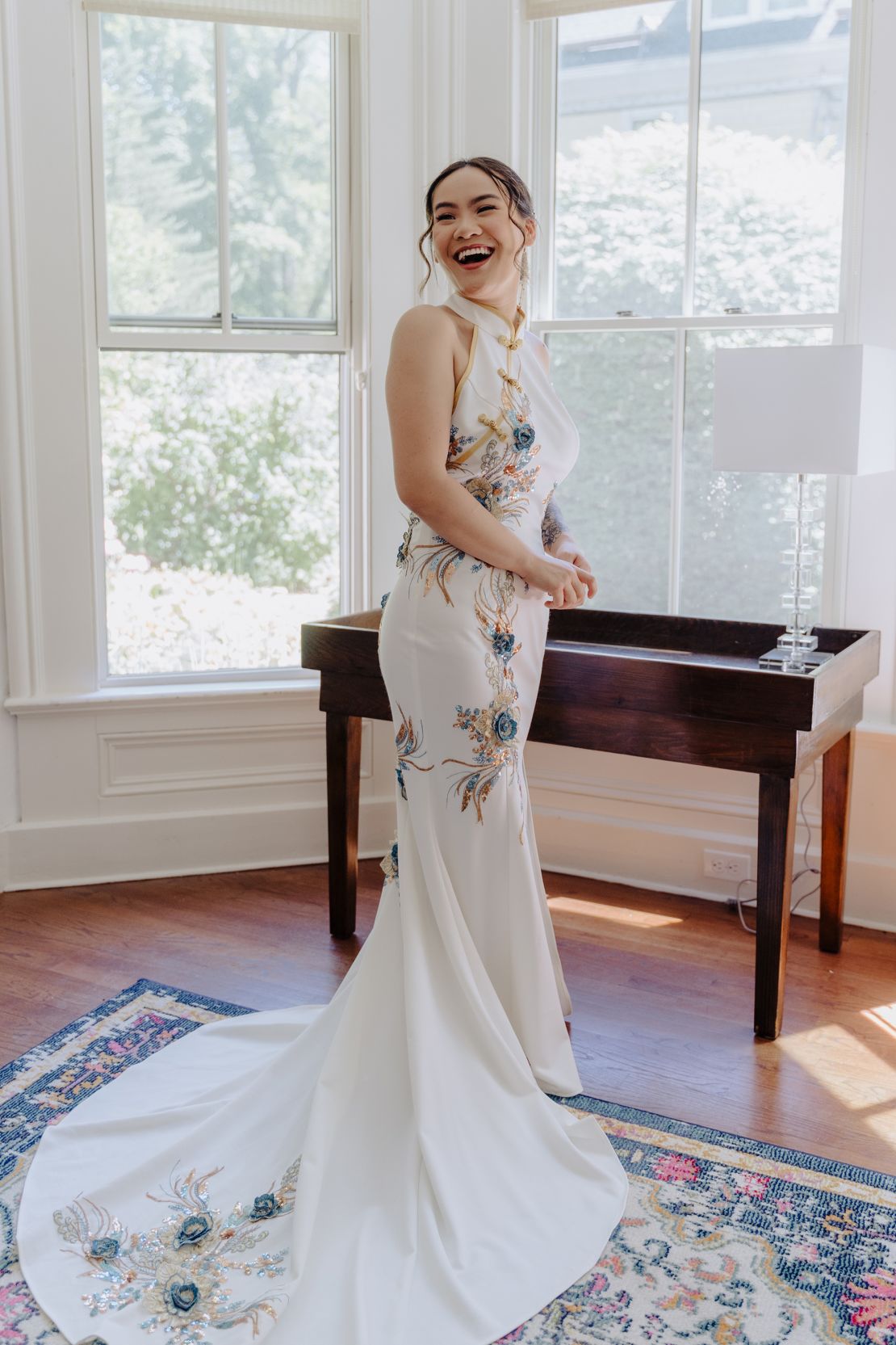 This dress, also by East-Meets-Dress, featured cobalt blue-color embroidery, to nod to the groom's Mexican culture.