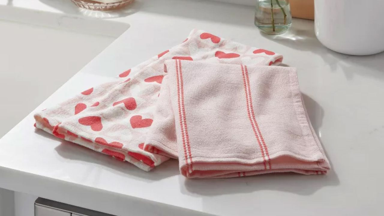 Two hand towels on a kitchen counter.