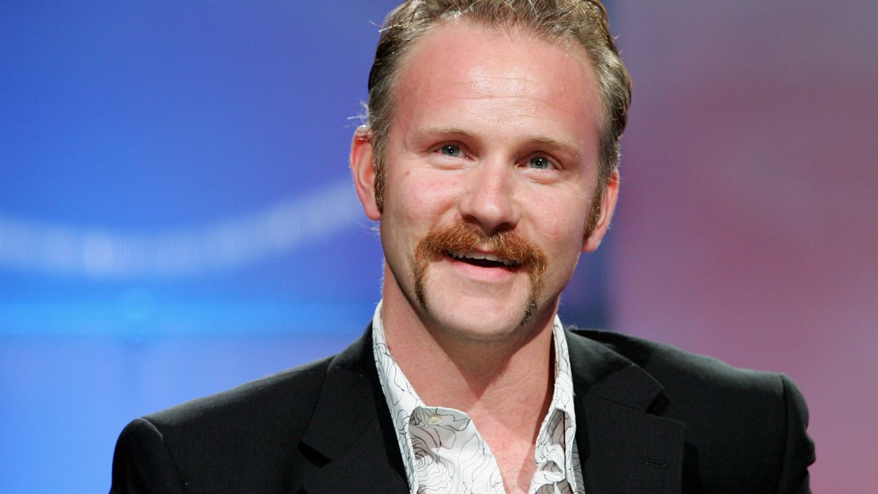 LAS VEGAS - JULY 27:  Filmmaker Morgan Spurlock jokes with an audience member as he accepts the award for Documentary Title of the Year for the movie "Super Size Me" at the Video Software Dealers Association's award show at the organization's annual home video convention at the Bellagio July 27, 2005 in Las Vegas, Nevada.  (Photo by Ethan Miller/Getty Images)