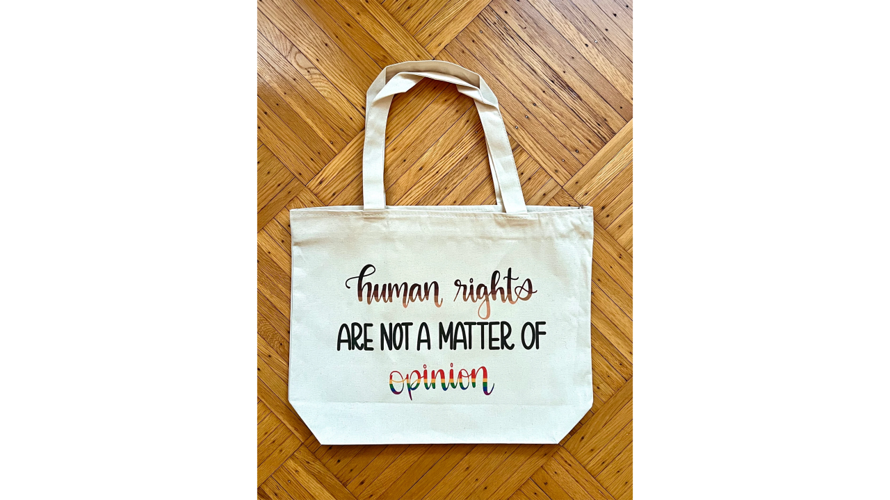 A tote bag that says human rights are never a matter of opinion.