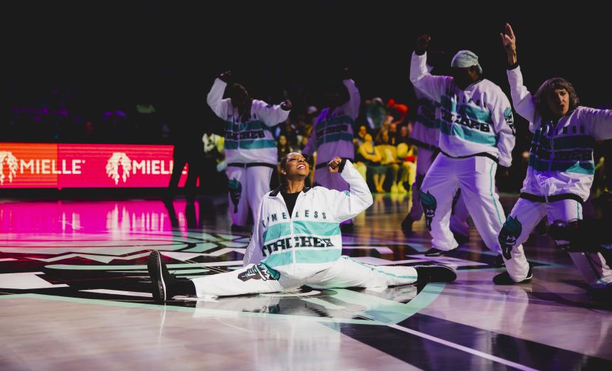 Phyllis Spencer does the splits during a Timeless Torches performance.
