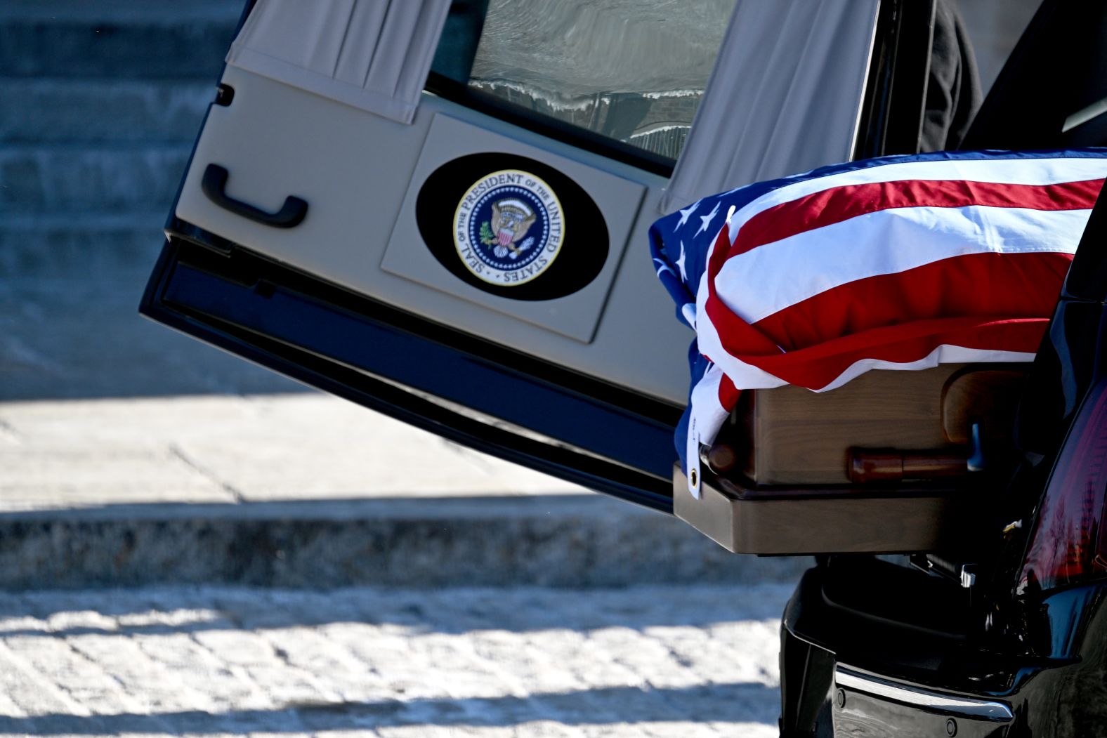 Carter's casket sits in a hearse outside the cathedral.