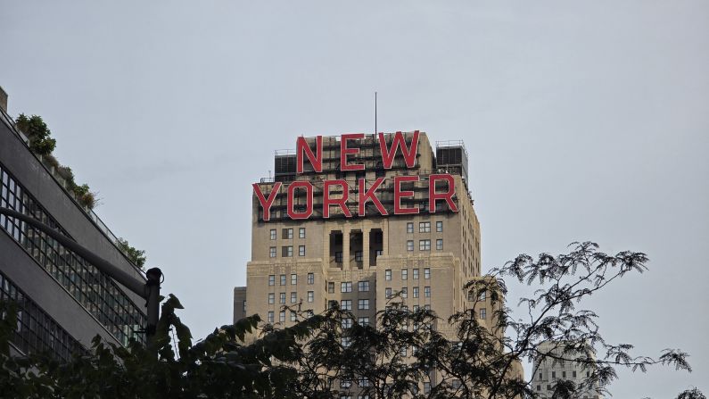 The view of The New Yorker hotel signage from the street, zoomed in a little