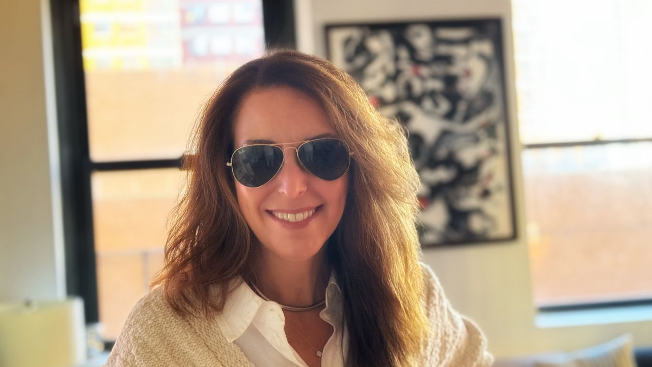 Wearing Ray-Ban Classic Aviator sunglasses