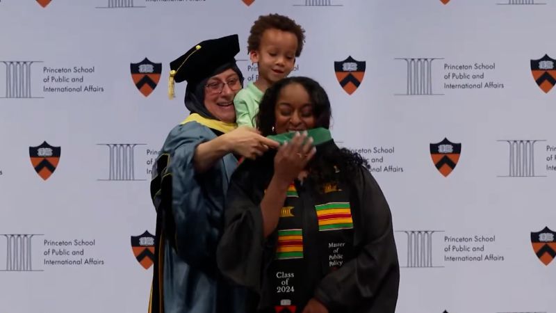 Toddler goes viral helping mom graduate on stage at Princeton
