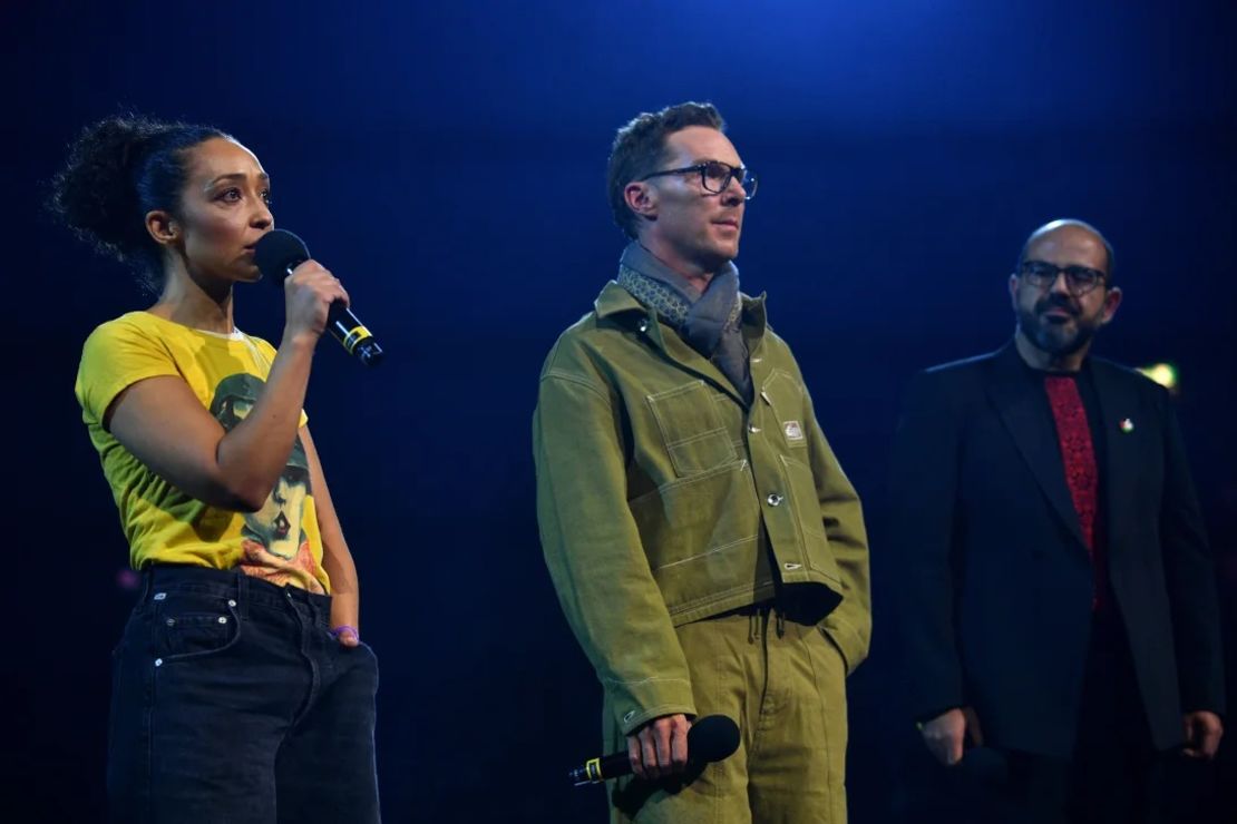 Ruth Negga, Benedict Cumberbatch and Amer Hlehel speak onstage during the "Together For Palestine" concert.