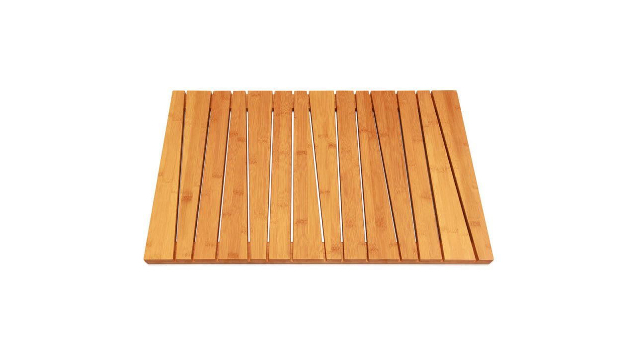 Bamboo bath mat placed against white background.