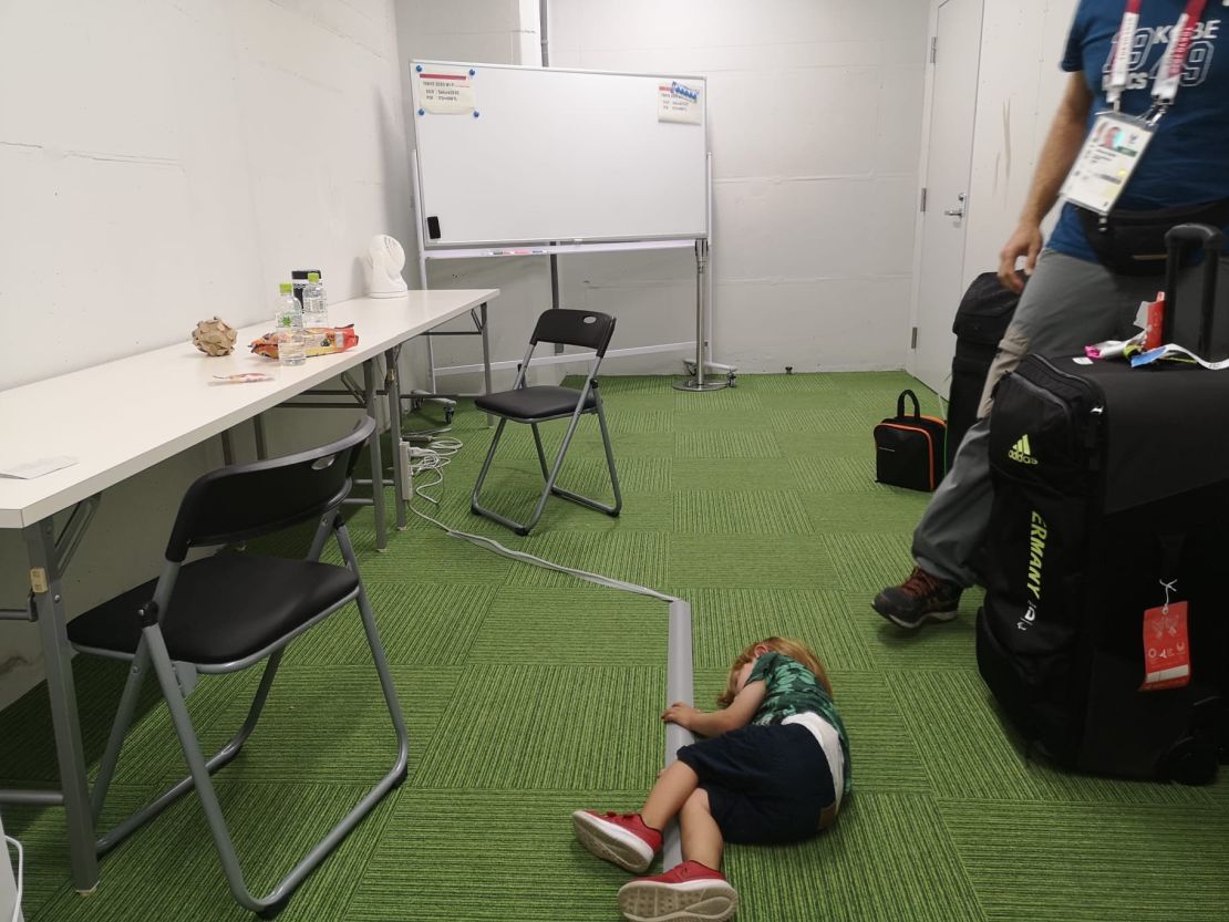 German Paralympian Edina Müller's son lays on the floor in the room athletes were directed towards to spend time with, care for, and breastfeed their young children during the Tokyo Olympic Games in 2021, according to Müller.