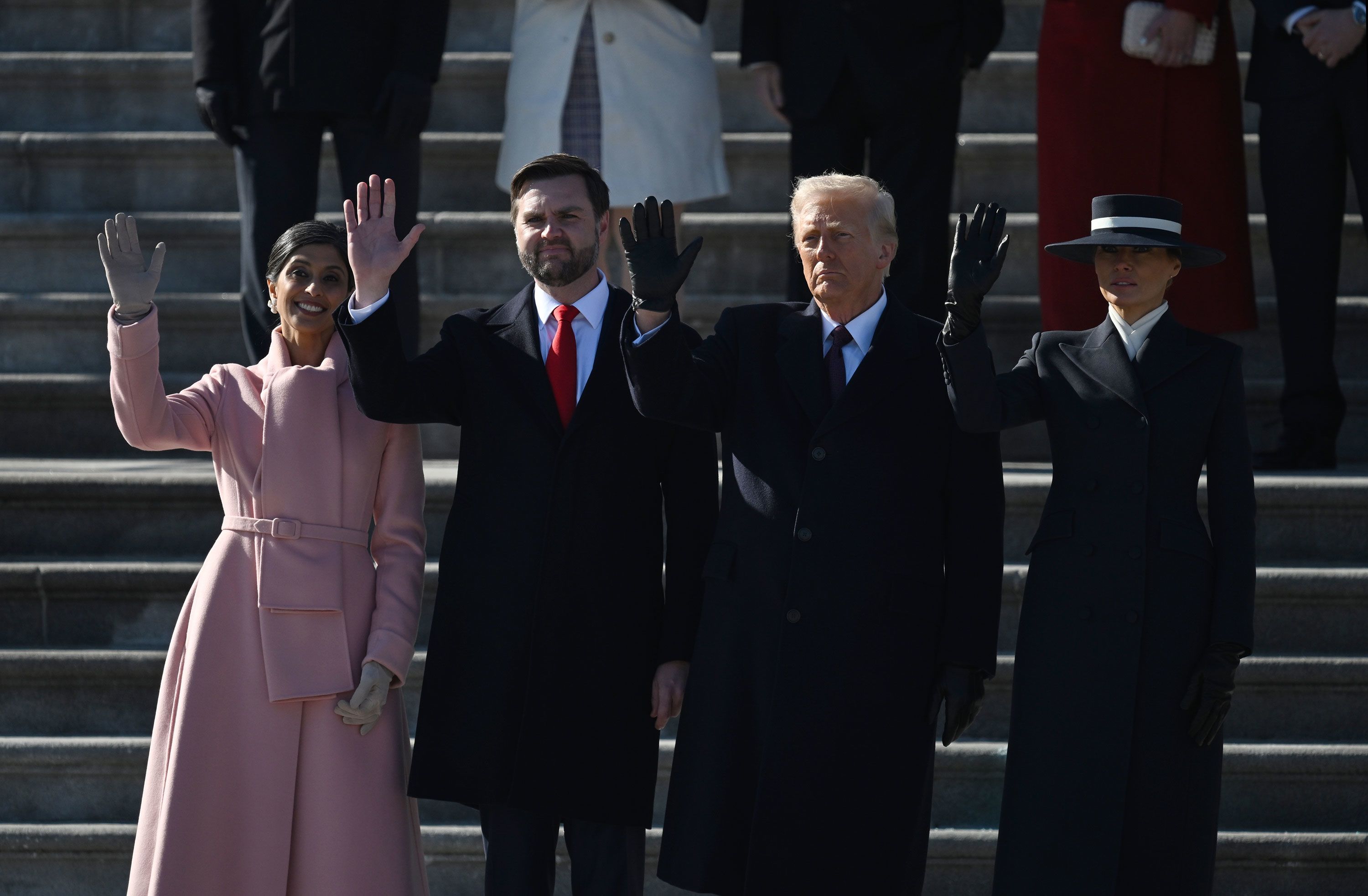 Along with their wives, Vance and Trump wave as Biden departs from the East Front of the US Capitol.