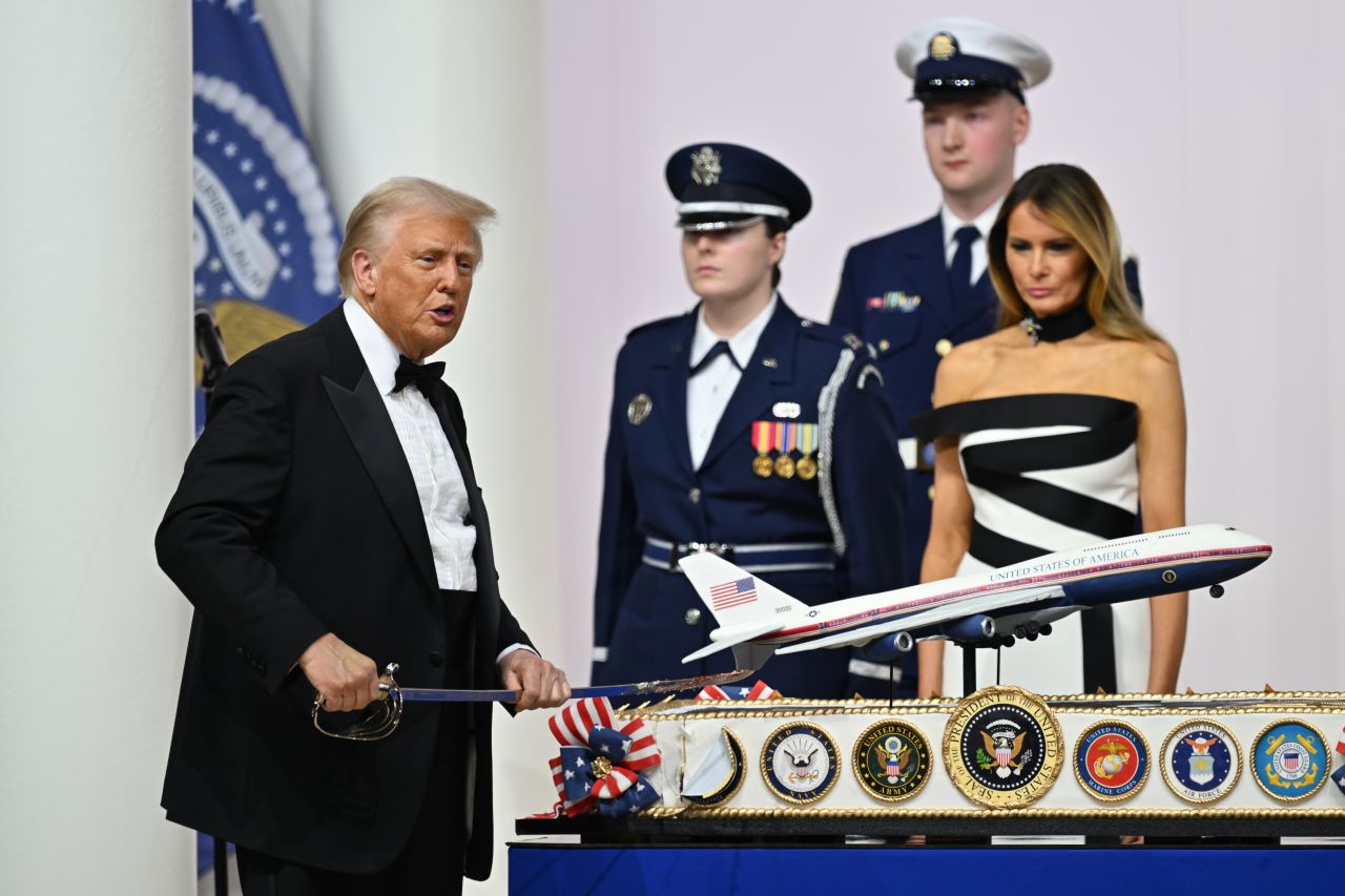 Trump cuts a cake during the Commander-in-Chief ball on Monday.