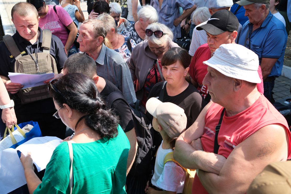 Oksana (center, in black) and Oleh (second from the right) decided to take their family out of Pokrovsk once the explosions became too frequent.