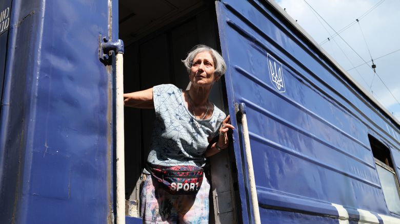 A woman from the Pokrovsk area boards an evacuation train amid continuing Russian advances towards the city.