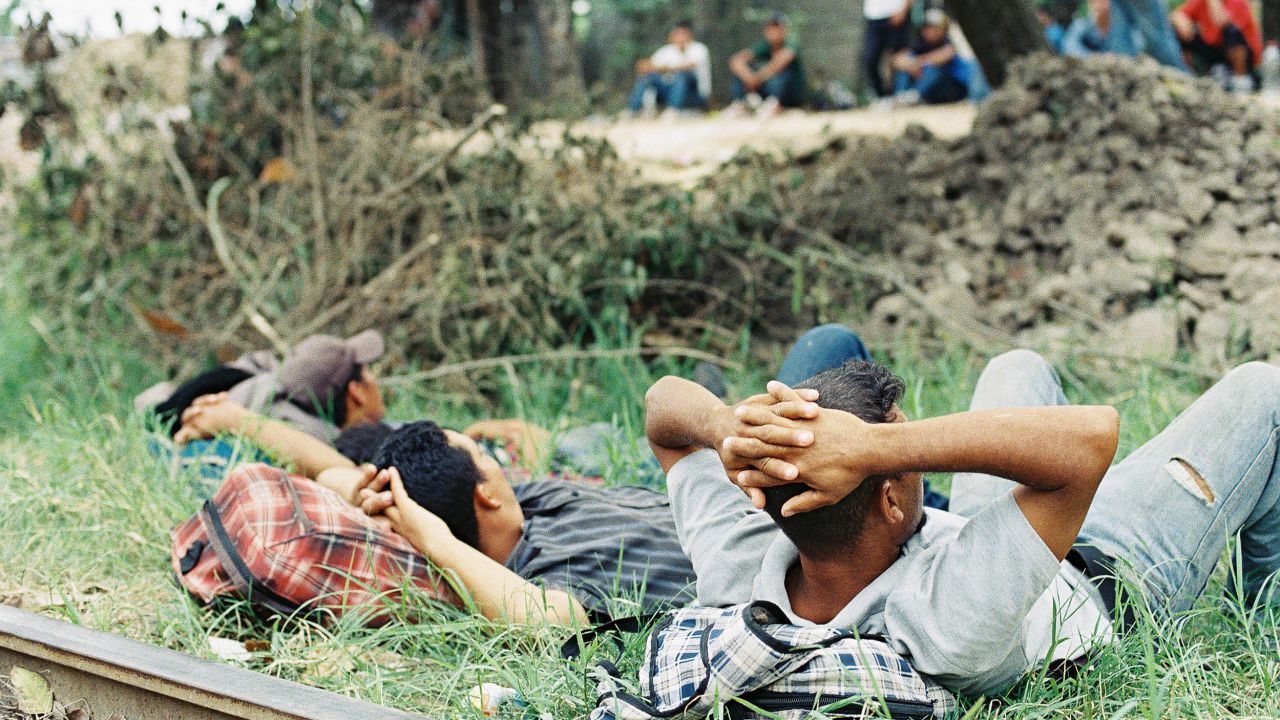 A group of young Central American migrants and smugglers on the train tracks in Pakal-Na, Chiapas, Mexico 2017.