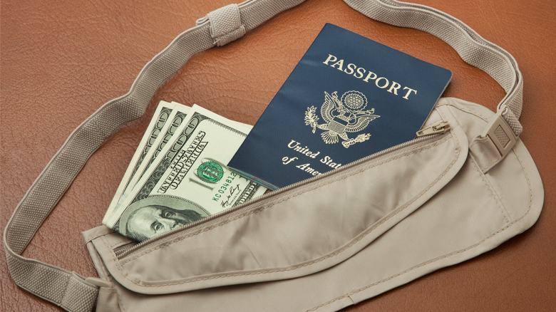 Money Belt with money and Passport on suitcase