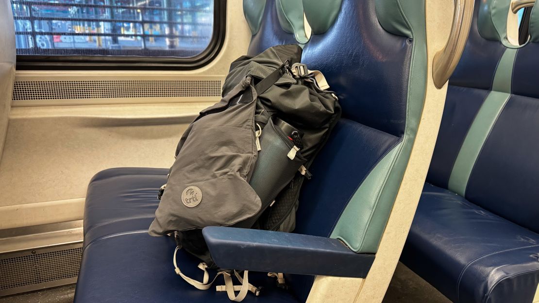 Trtl pillow with backpack on train in Europe